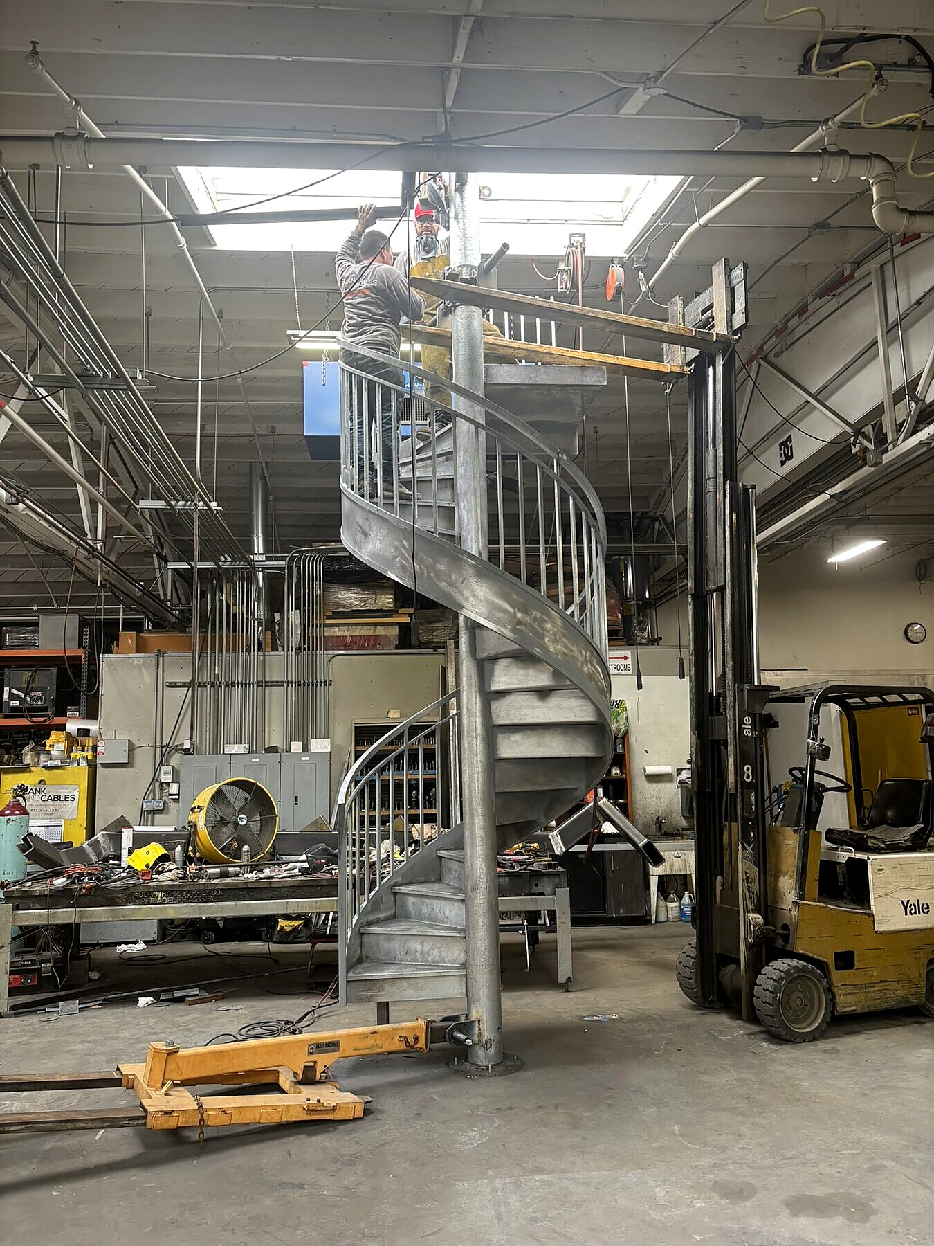 Custom mild steel spiral staircase, shop fabrication