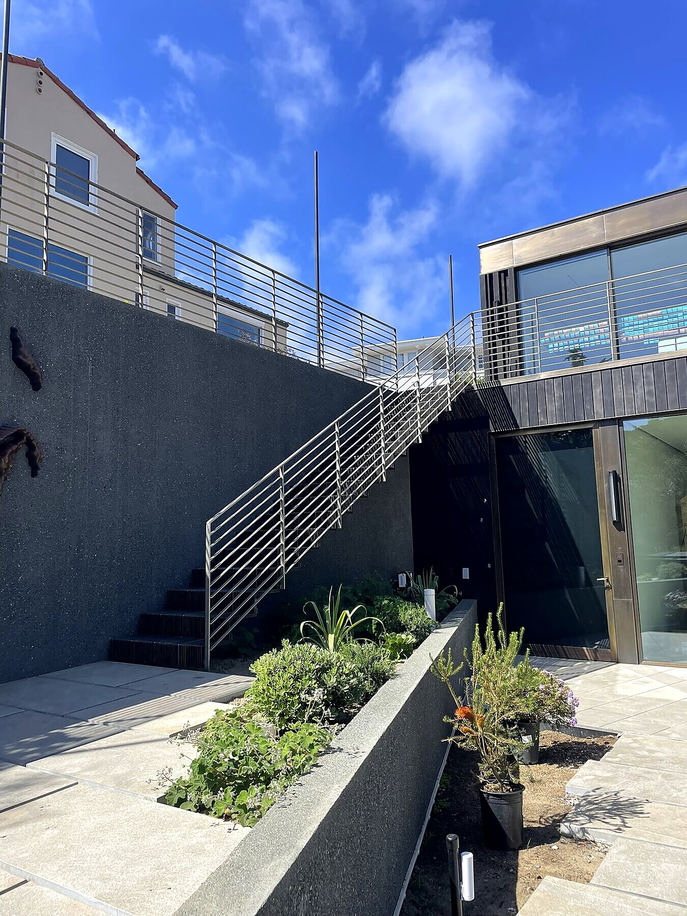Stainless steel cable railing on an exterior stair, coastal property
